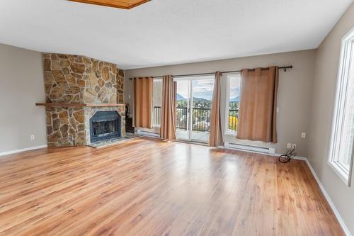 1/2/3 - 2303 Crawford Street, Creston, BC - Indoor Photo Showing Living Room With Fireplace