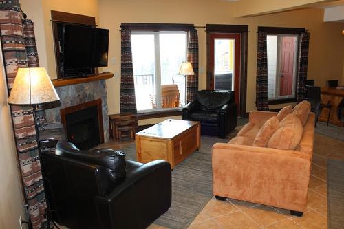 E2-D - 1351 Gerry Sorensen Way, Kimberley, BC - Indoor Photo Showing Living Room With Fireplace