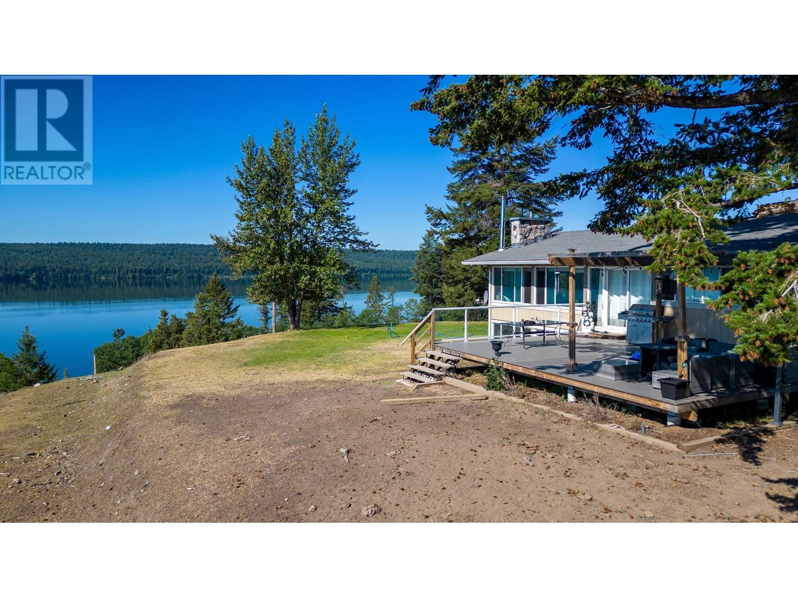 3920 Trout Drive, Lac La Hache, BC - Outdoor With Body Of Water With Deck Patio Veranda With View