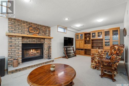 302 Spencer Place, Saskatoon, SK - Indoor Photo Showing Living Room With Fireplace