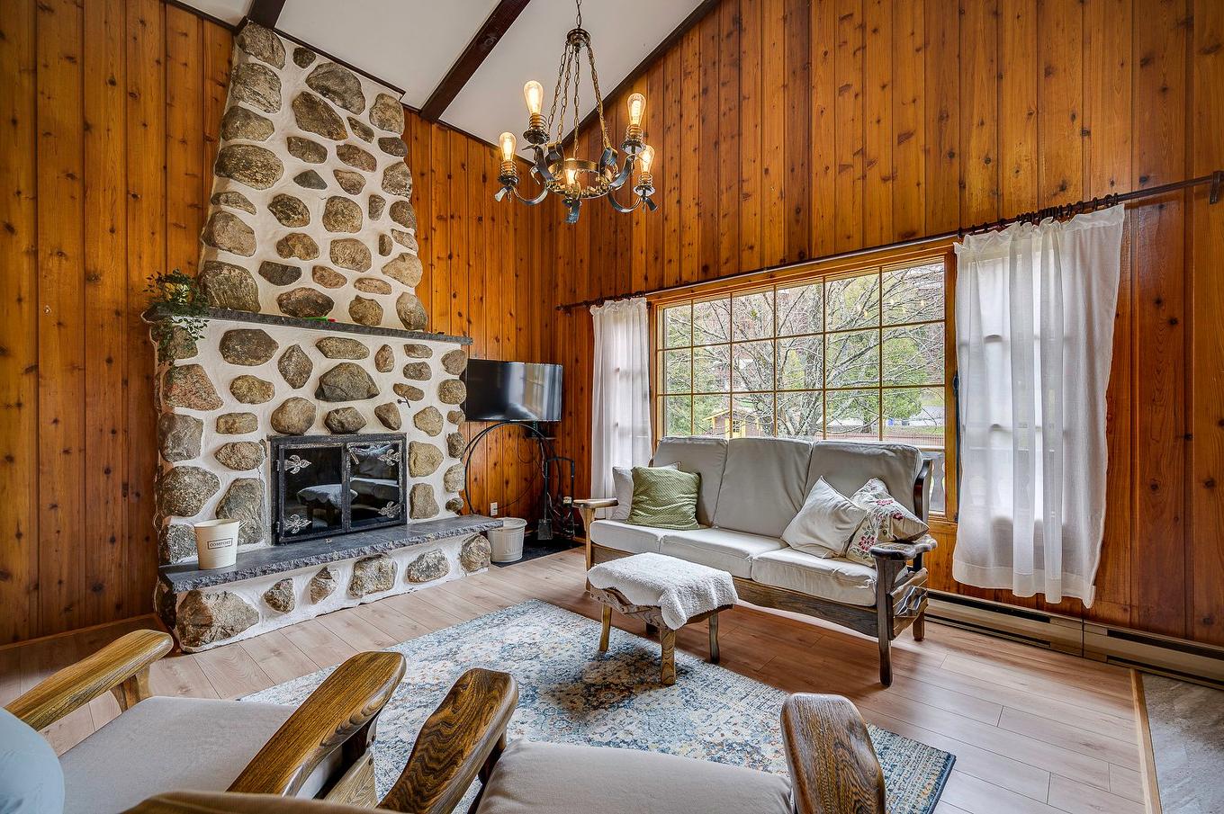 Living room - 267 Ch. Des Bois-Blancs, Piedmont, QC - Indoor Photo Showing Living Room With Fireplace