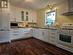 Large, open kitchen with ample cabinetry