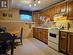 Lower level kitchen with full size refrigerator and stove