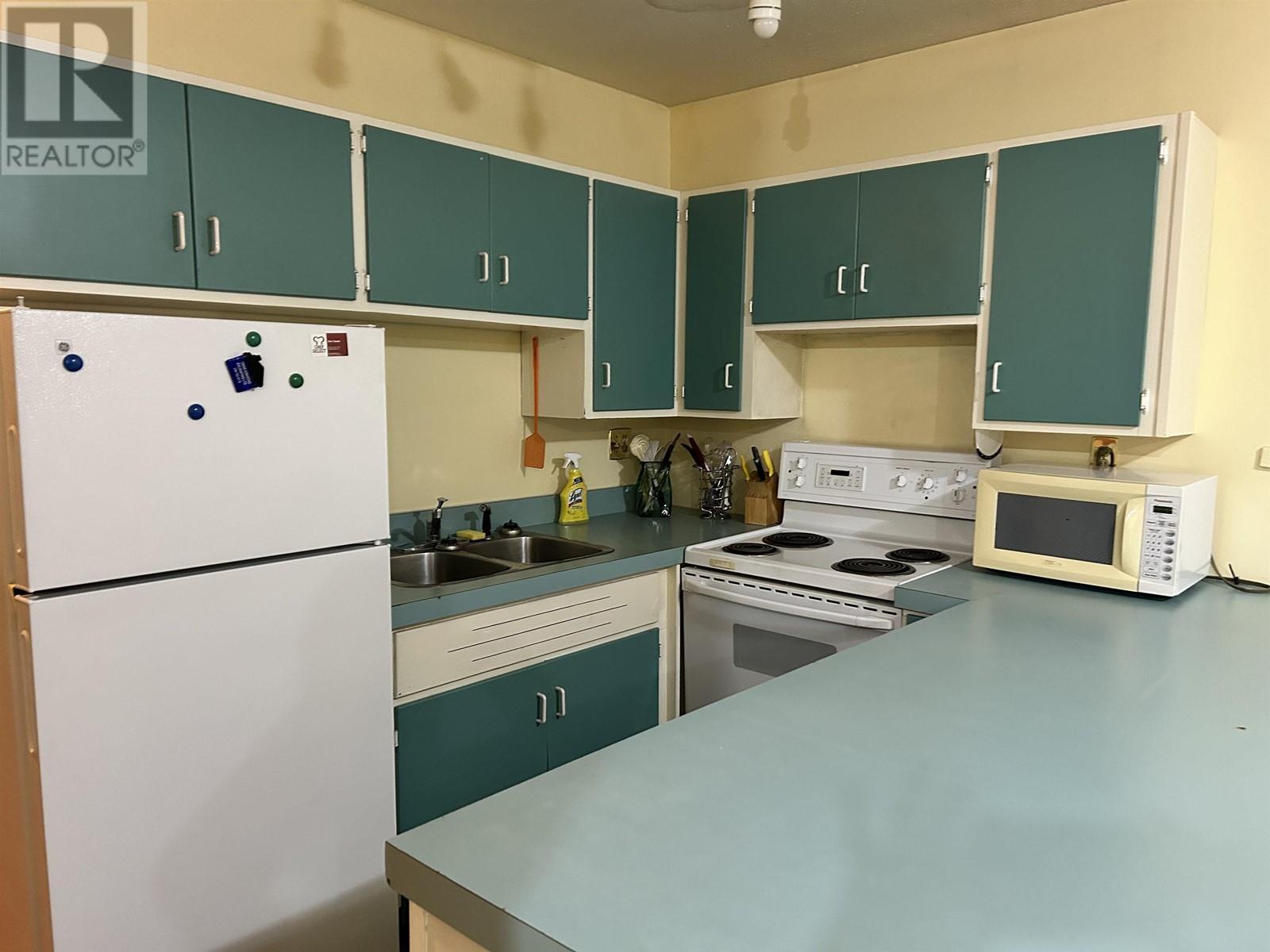 10321 Gething Street, Fort St. John, BC - Indoor Photo Showing Kitchen With Double Sink