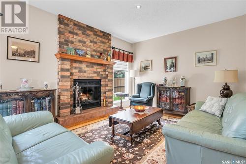 439 Wakabayashi Crescent, Saskatoon, SK - Indoor Photo Showing Living Room With Fireplace