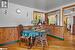 Dining space with wooden walls and light hardwood / wood-style flooring