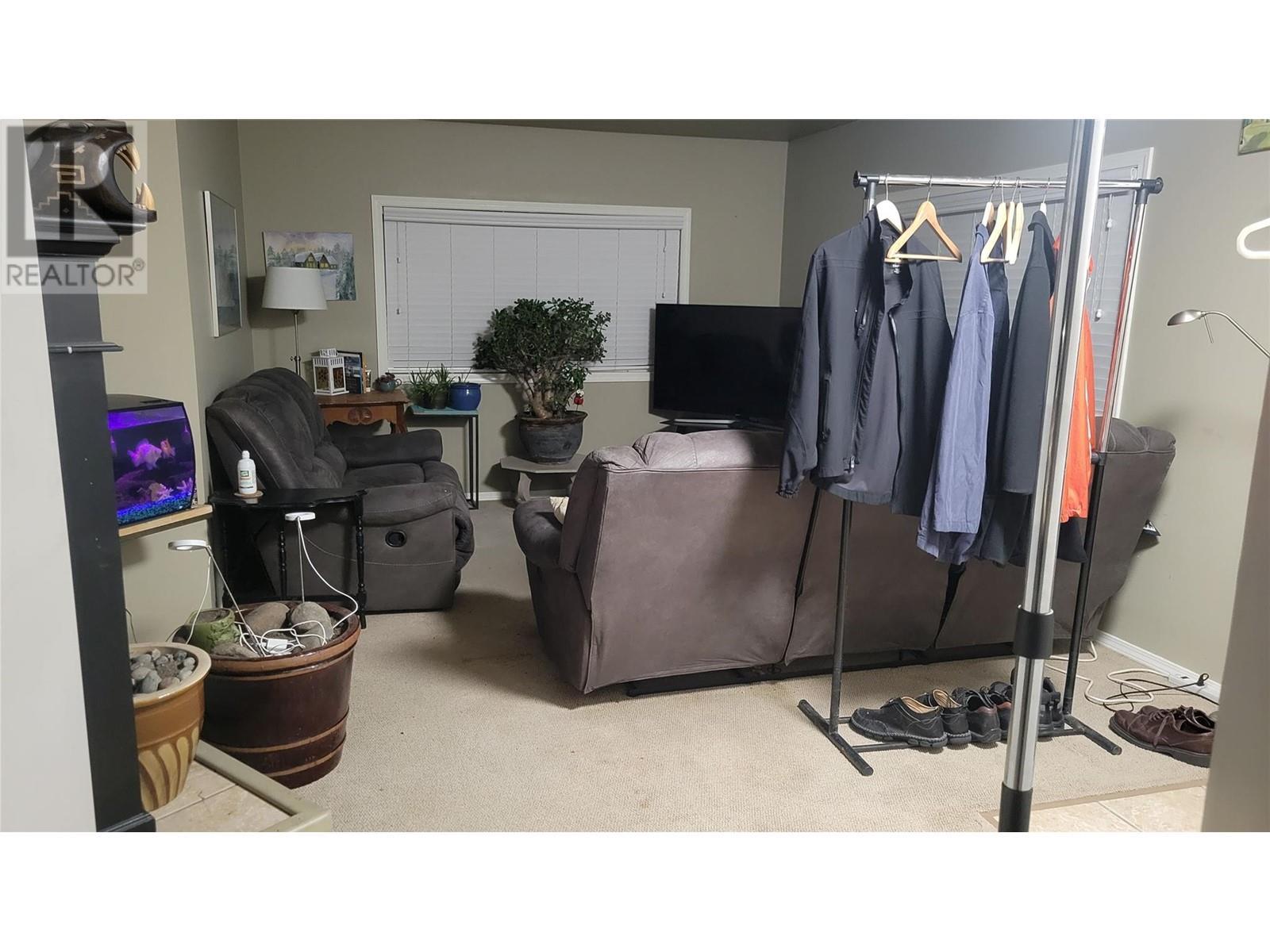 House Living Room - 173 Larson Road, Christina Lake, BC