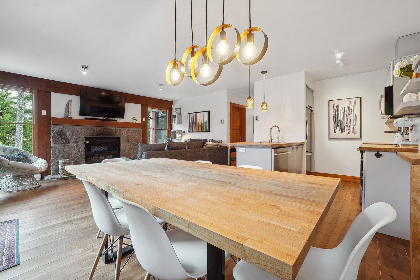 Overall view - 110-1 Ch. De La Fraternité, Lac-Supérieur, QC - Indoor Photo Showing Dining Room With Fireplace