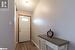 Doorway to outside featuring dark hardwood / wood-style flooring and a textured ceiling