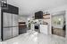 Kitchen with butcher block counters, light hardwood / wood-style flooring, tasteful backsplash, white cabinetry, and appliances with stainless steel finishes