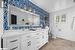 Bathroom featuring a shower, vanity, toilet, and backsplash