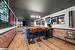 Bar featuring light hardwood / wood-style floors and brick wall