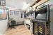 Office space with a paneled ceiling and light hardwood / wood-style flooring