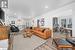 Living room with light hardwood / wood-style floors