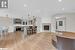 Living room with light hardwood / wood-style flooring and vaulted ceiling