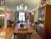 Dining room featuring an inviting chandelier, wood-type flooring, and ornamental molding