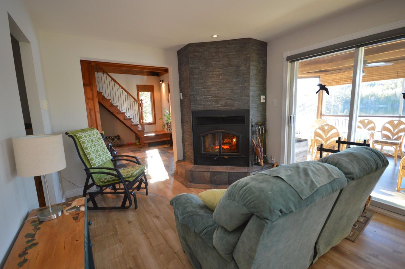 Living room - 9990 Ch. Du Lac-Labelle, Labelle, QC - Indoor Photo Showing Living Room With Fireplace