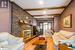 Living room featuring beam ceiling, a fireplace, and wood-type flooring