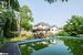 View of pool featuring a gazebo and a playground