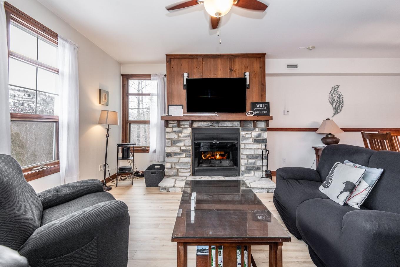 Living room - 2-209 Ch. Des Quatre-Sommets, Mont-Tremblant, QC - Indoor Photo Showing Living Room With Fireplace
