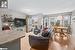 Living room featuring light wood-type flooring and a textured ceiling