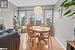 Dining area with light wood-type flooring and a wealth of natural light