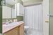 Full bathroom with tile patterned floors, vanity, toilet, and shower / bathtub combination with curtain