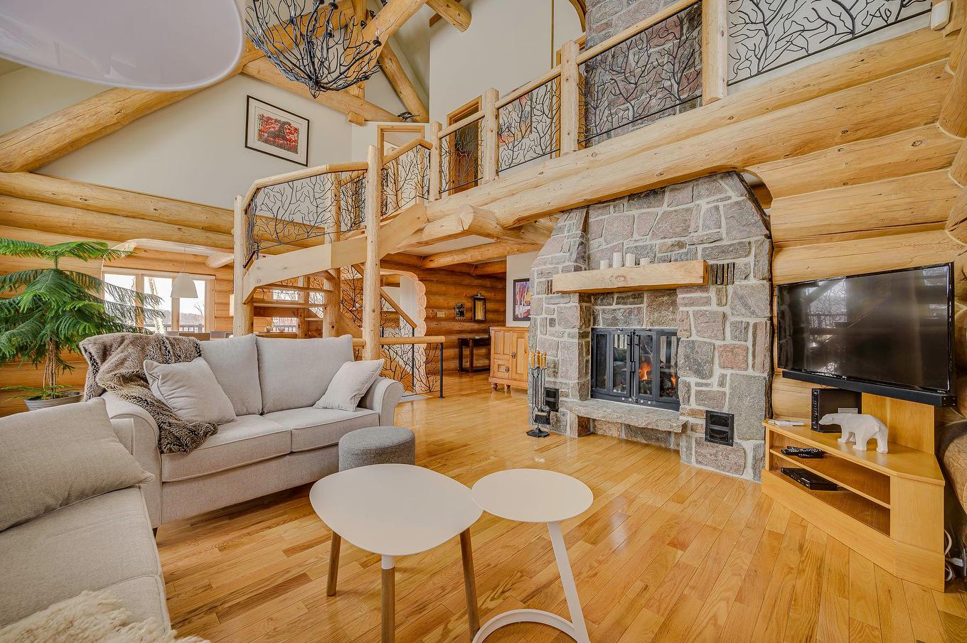 Living room - 105 Ch. Des Ancêtres, Mont-Tremblant, QC - Indoor Photo Showing Living Room With Fireplace