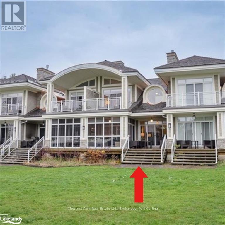 G103-A - 1869 Muskoka 118 Road W, Muskoka Lakes (Monck (Muskoka Lakes)), ON - Outdoor With Balcony With Deck Patio Veranda With Facade