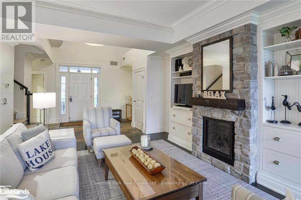 G103-A - 1869 Muskoka 118 Road W, Muskoka Lakes (Monck (Muskoka Lakes)), ON - Indoor Photo Showing Living Room With Fireplace