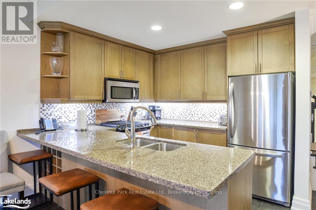G103-A - 1869 Muskoka 118 Road W, Muskoka Lakes (Monck (Muskoka Lakes)), ON - Indoor Photo Showing Kitchen With Double Sink With Upgraded Kitchen