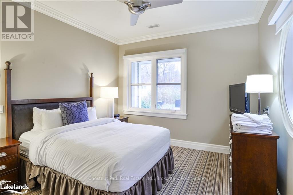 G103-A - 1869 Muskoka 118 Road W, Muskoka Lakes (Monck (Muskoka Lakes)), ON - Indoor Photo Showing Bedroom