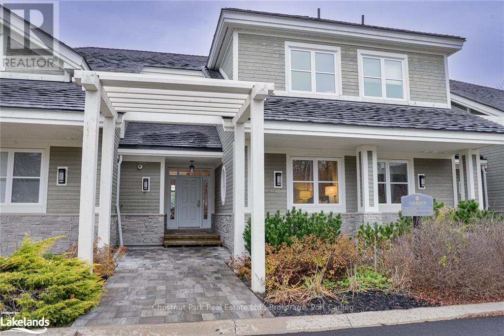 G103-A1 - 1869 Muskoka 118 Road W, Muskoka Lakes (Monck (Muskoka Lakes)), ON - Outdoor With Deck Patio Veranda With Facade