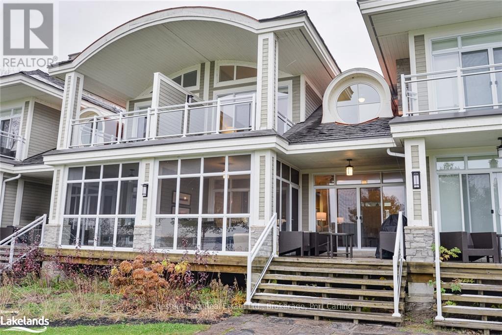 G103-A1 - 1869 Muskoka 118 Road W, Muskoka Lakes (Monck (Muskoka Lakes)), ON - Outdoor With Balcony With Facade