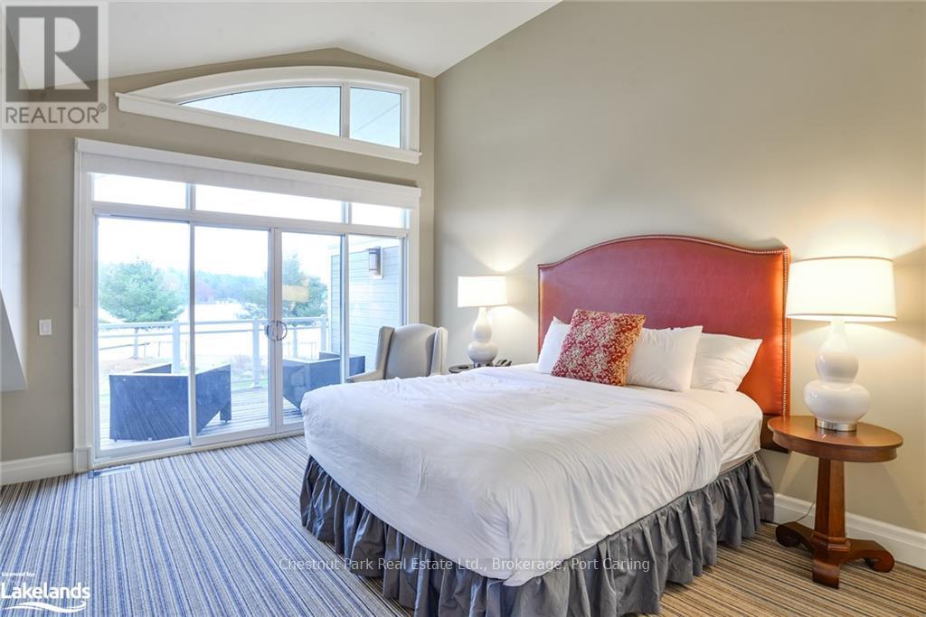 G103-A1 - 1869 Muskoka 118 Road W, Muskoka Lakes (Monck (Muskoka Lakes)), ON - Indoor Photo Showing Bedroom