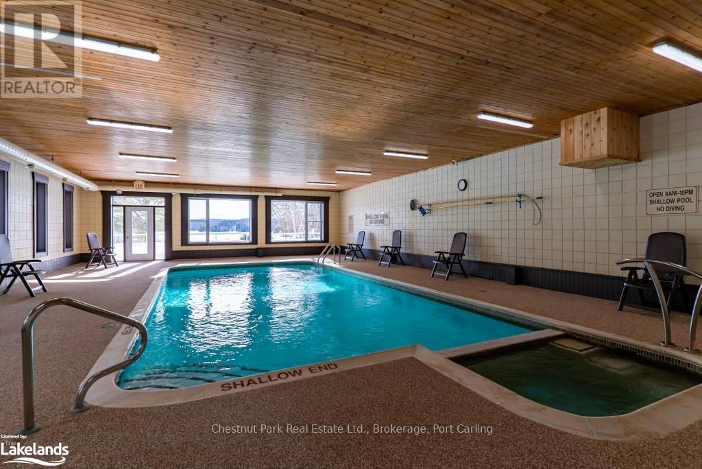 108-8 - 1052 Rat Bay Road, Lake Of Bays (Franklin), ON - Indoor Photo Showing Other Room With In Ground Pool