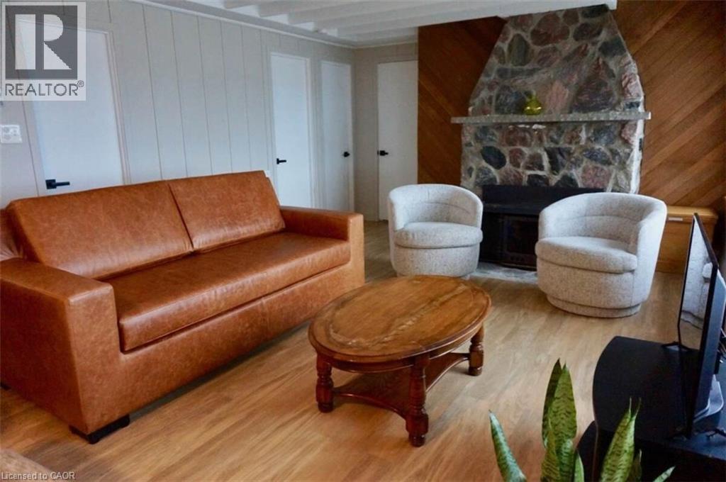 1536 Tiny Beaches Road N, Tiny, ON - Indoor Photo Showing Other Room With Fireplace