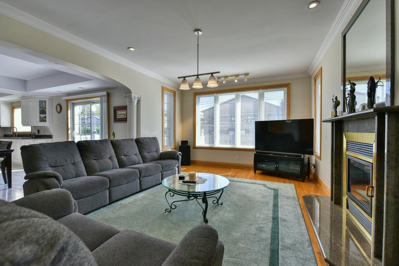 Family room - 3 Rue Du Chablis, Kirkland, QC - Indoor Photo Showing Living Room With Fireplace