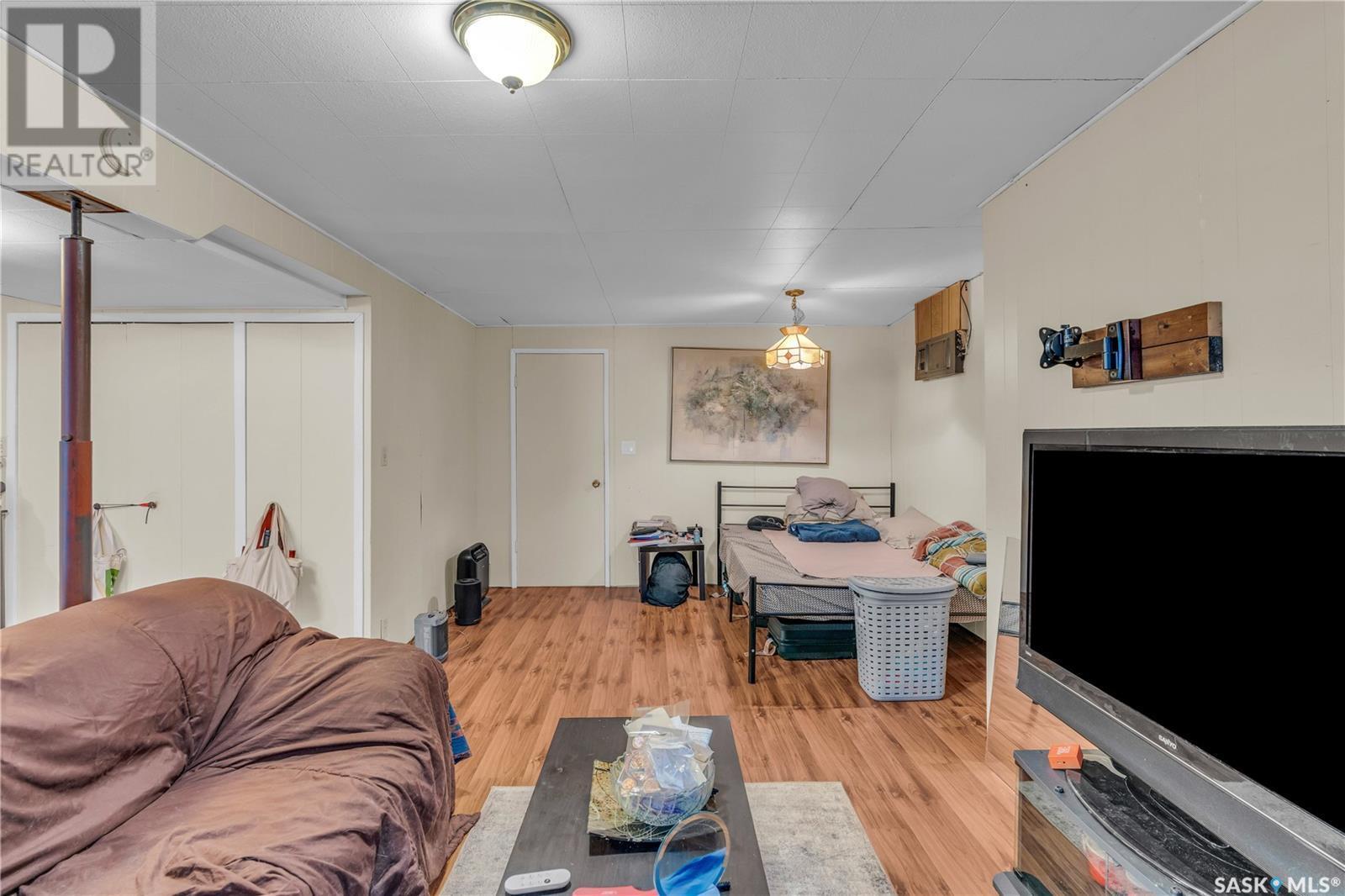 201 Blackstock Street, Strasbourg, SK - Indoor Photo Showing Other Room With Fireplace