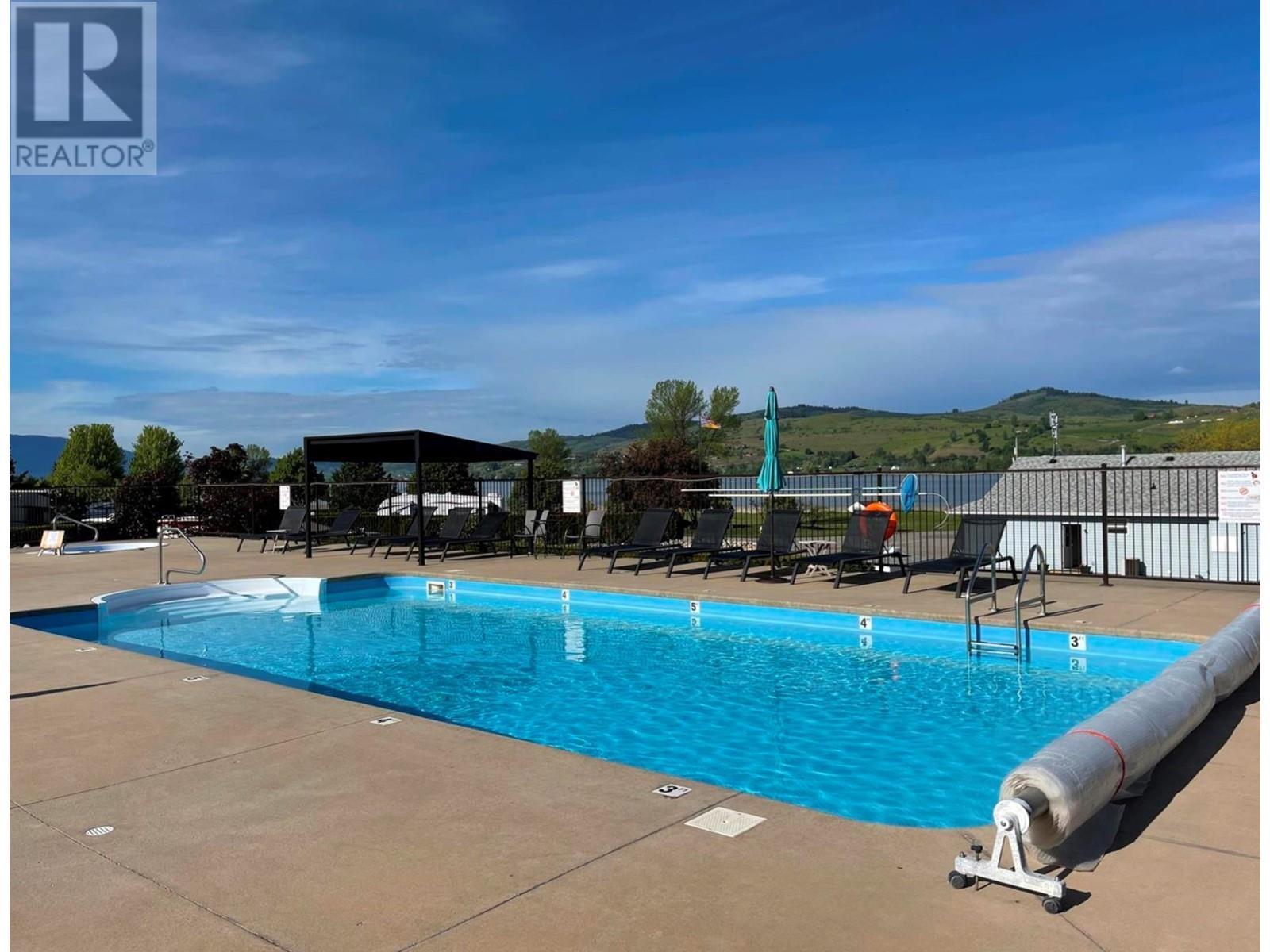 Community pool - 8000 Highland Road Unit# 42, Vernon, BC - Outdoor With In Ground Pool