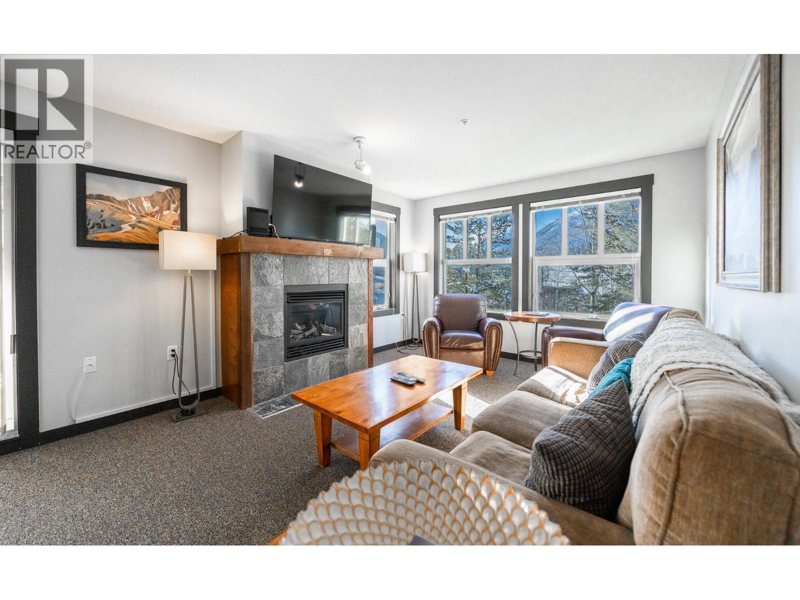 2070 Summit Drive Unit# 301A, Panorama, BC - Indoor Photo Showing Living Room With Fireplace