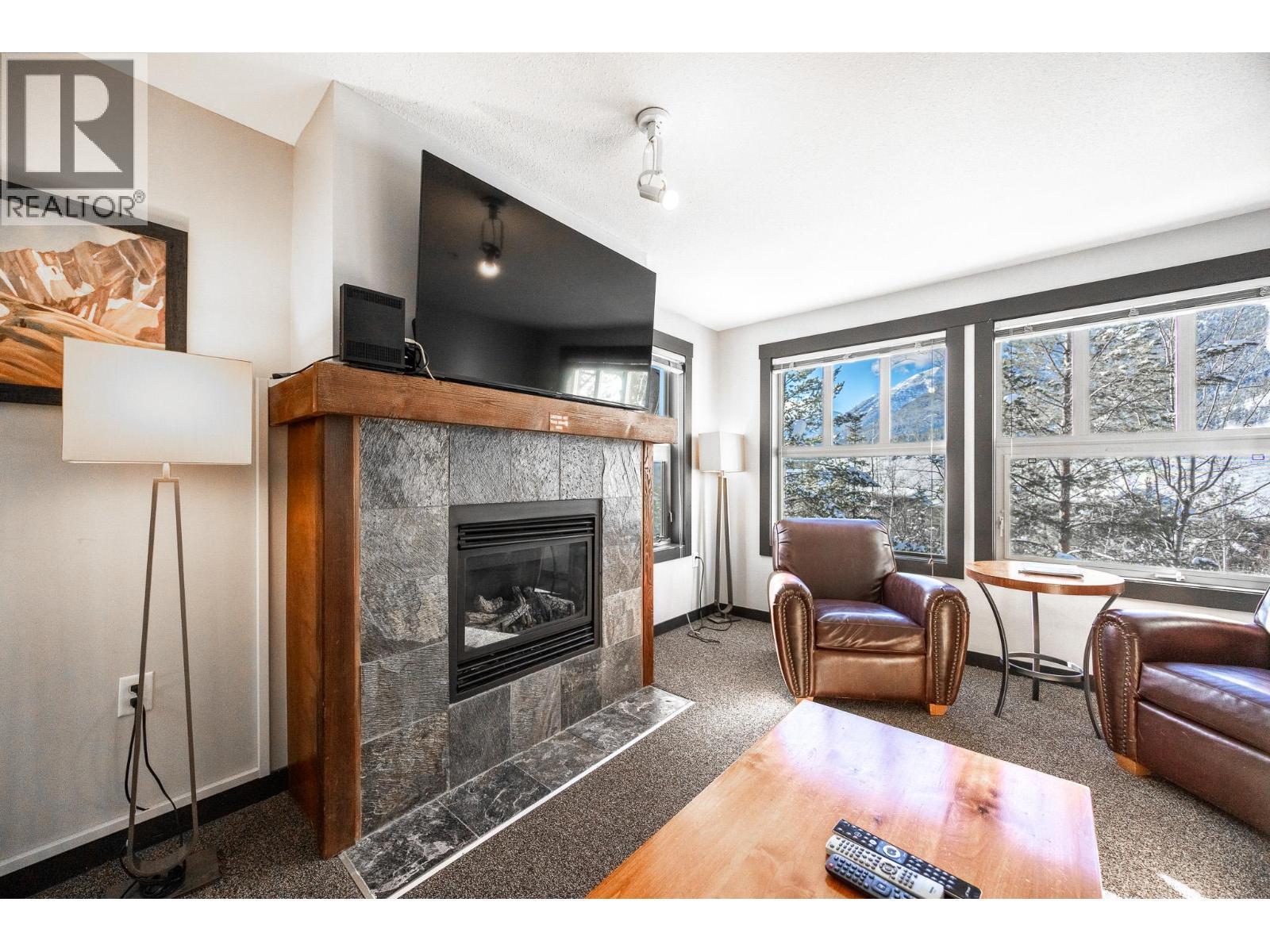 2070 Summit Drive Unit# 301A, Panorama, BC - Indoor Photo Showing Living Room With Fireplace