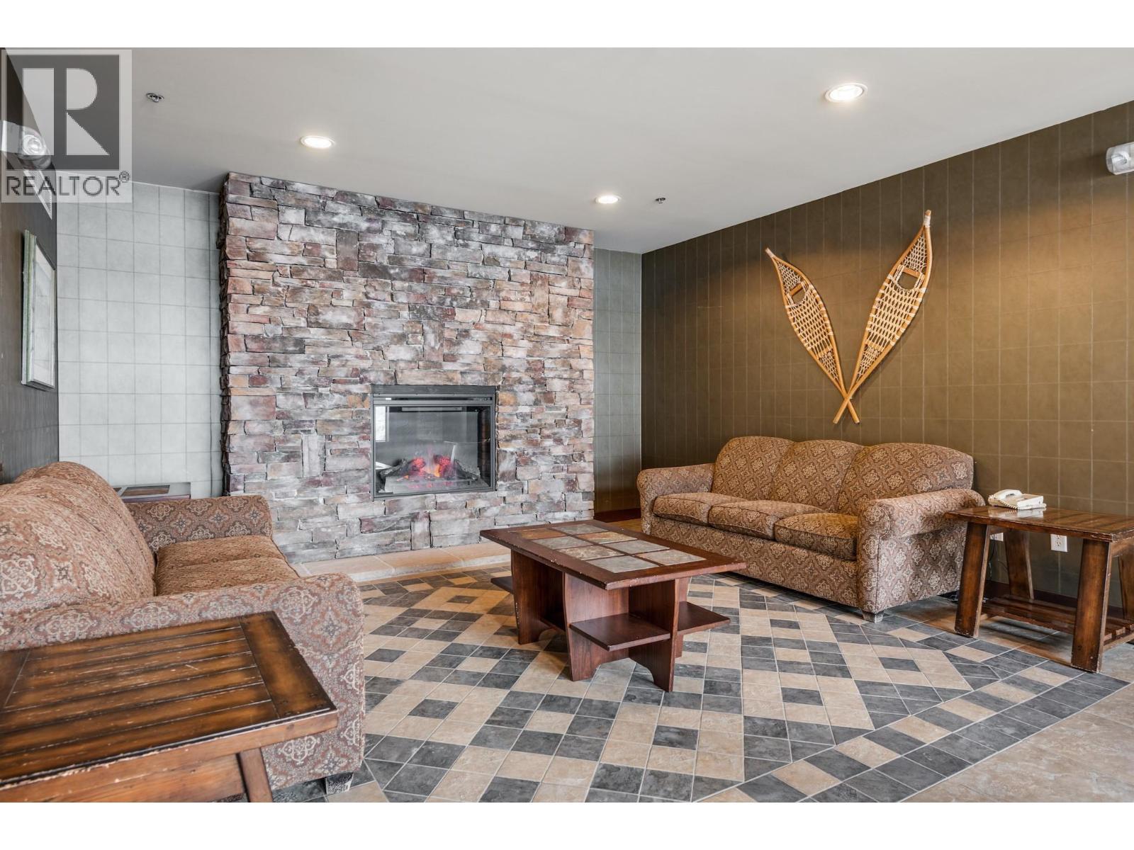2070 Summit Drive Unit# 301A, Panorama, BC - Indoor Photo Showing Living Room With Fireplace