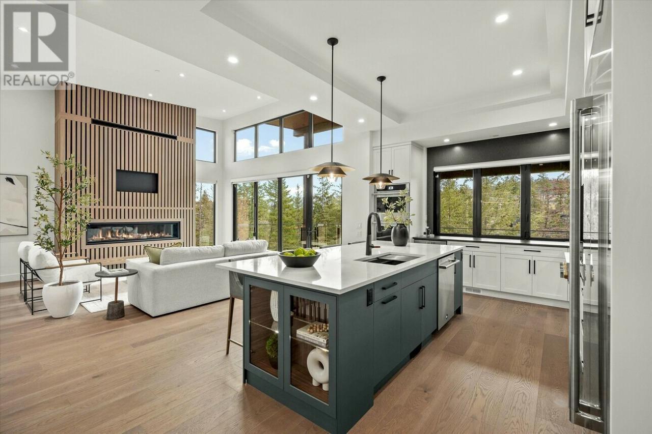 124 Wildsong Crescent W, Vernon, BC - Indoor Photo Showing Kitchen With Fireplace With Upgraded Kitchen