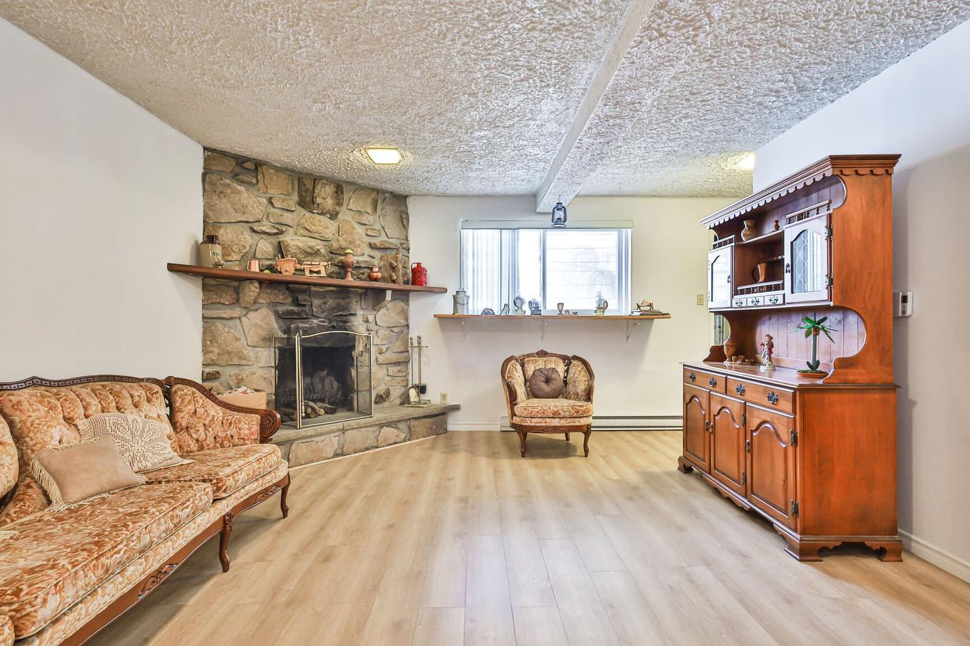 Family room - 1860 Rue Favreau, Laval (Chomedey), QC - Indoor Photo Showing Living Room With Fireplace