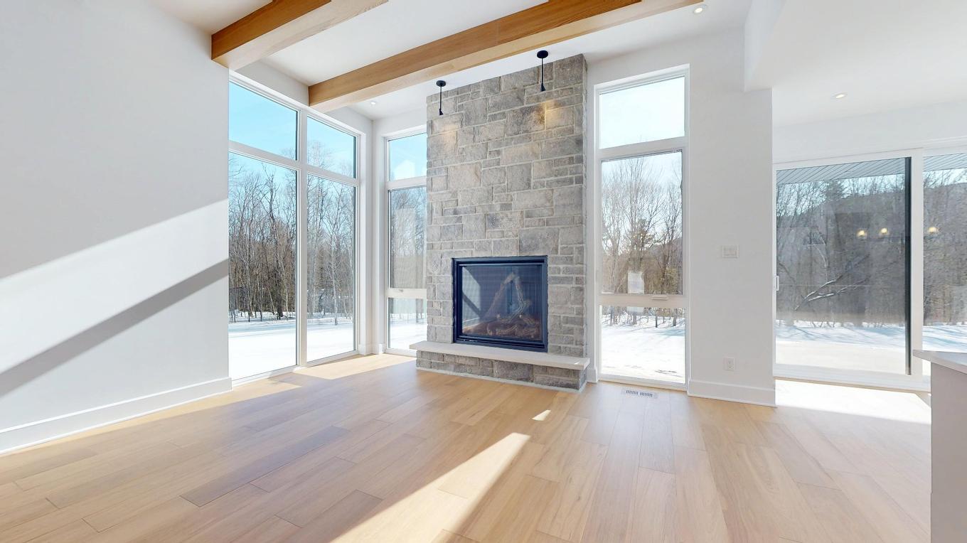 Salon - 1704 Place Des Centaurées, Piedmont, QC - Indoor With Fireplace