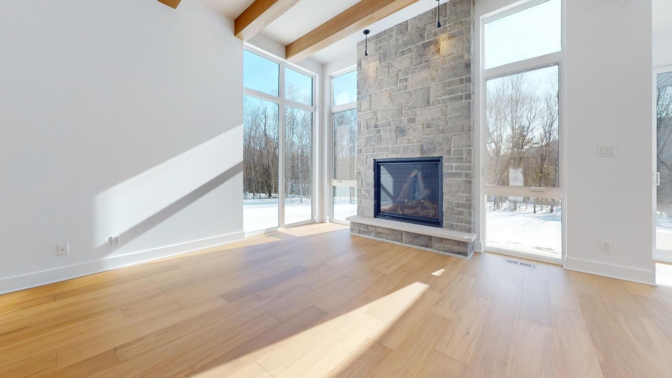 Salon - 1704 Place Des Centaurées, Piedmont, QC - Indoor With Fireplace