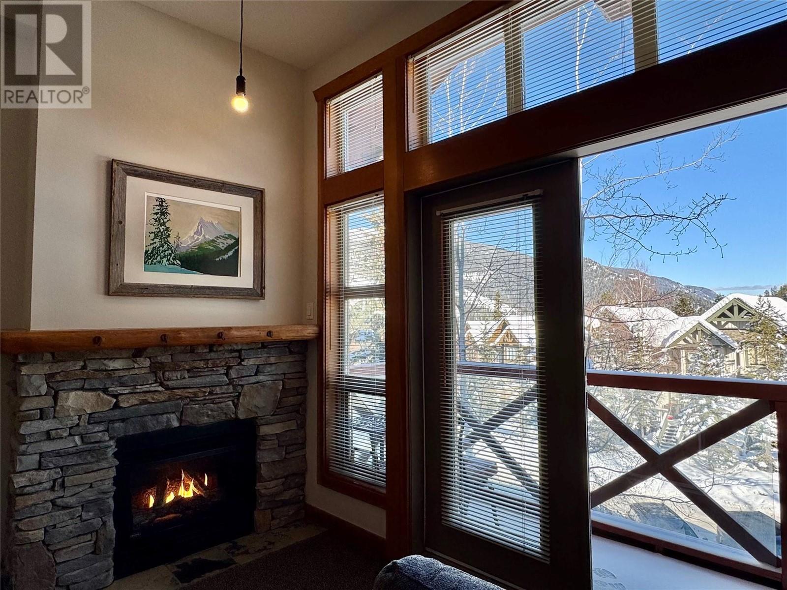 2080 Summit Drive Unit# 412, Panorama, BC - Indoor Photo Showing Other Room With Fireplace