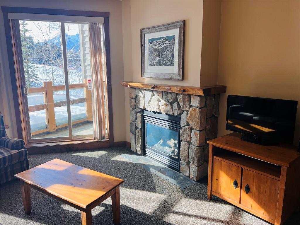 203-2090 Summit Drive, Panorama, BC - Indoor Photo Showing Living Room With Fireplace