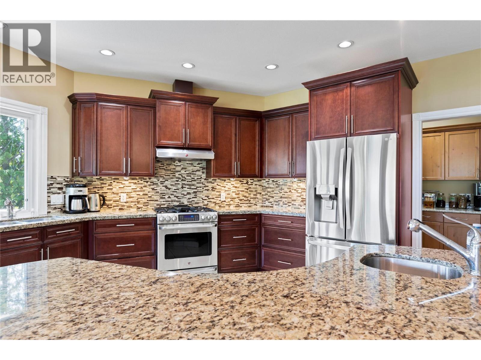 Custom designed Island with bar sink - 8738 Squilax Anglemont Road, St. Ives, BC - Indoor Photo Showing Kitchen With Double Sink With Upgraded Kitchen